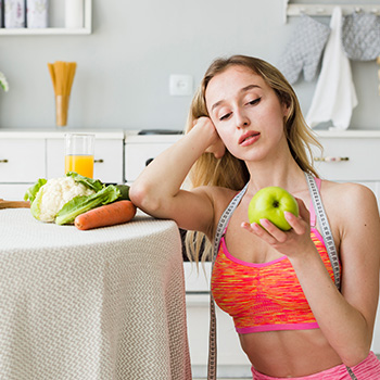 woman holding an apple