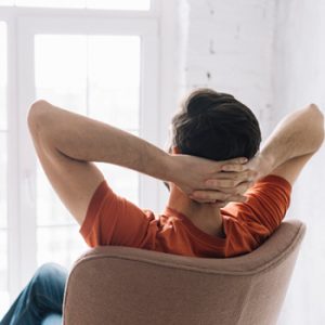 Man Sitting on Chair