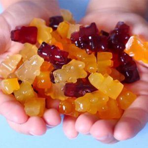 holding gummy bears in hand