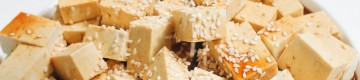tofu with sauce and sesame seeds