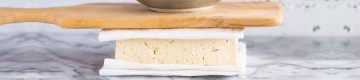 pressing a tofu with a knifeboard